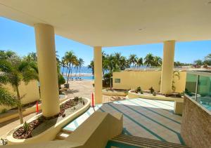 a view of the beach from the lobby of a resort at Bahiamar in Pampatar
