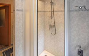 a bathroom with a shower with a glass door at Lovely Apartment In Mhl Rosin With Kitchen in Mühl Rosin