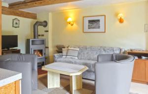 a living room with a couch and a fireplace at Beautiful Home In Grnow With Wifi in Grünow