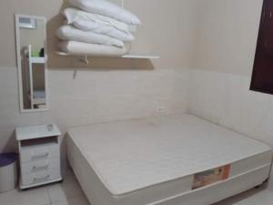 Ένα ή περισσότερα κρεβάτια σε δωμάτιο στο Sonho dos golfinhos