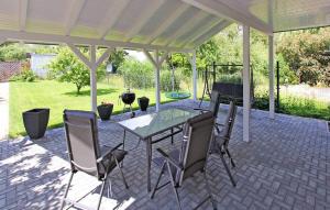 a patio with a table and chairs under a pavilion at Beautiful Home In Klink With Wifi in Klink