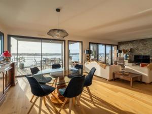 a living room with a table and chairs at Appartement Arcachon, 5 pièces, 8 personnes - FR-1-319-404 in Arcachon
