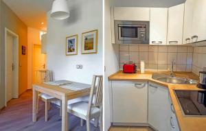 a small kitchen with a table and a microwave at Awesome Apartment In Ueckermnde seebad With Wifi in Neuendorf