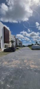 an empty parking lot with writing on the ground at SantoriniRD in Punta Cana