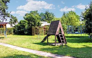 a small playground with a slide in a park at Lovely Apartment In Sommersdorf With Wifi in Sommersdorf