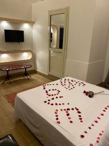 Voodi või voodid majutusasutuse Meramees Hotel toas