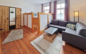 a living room with a couch and a table at Awesome Apartment In Wesenberg With Wifi in Wesenberg