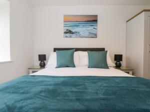 Giường trong phòng chung tại Wellfield Cottage