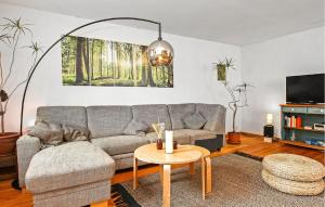 a living room with a couch and a table at Gorgeous Apartment In Mirow With Wifi in Mirow