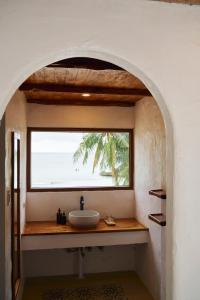 a bathroom with a sink and a window at Seaworthy Boracay in Boracay