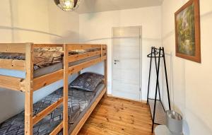 a bunk bed room with two bunk beds in it at 3 Bedroom Pet Friendly Apartment In Eldetal Ot Wredenhagen in Wredenhagen