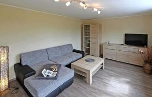 a living room with a couch and a table at 1 Bedroom Cozy Apartment In Mirow in Mirow