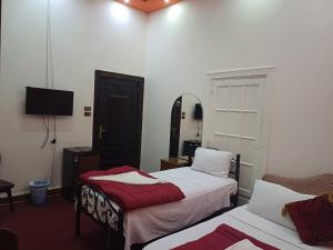 Voodi või voodid majutusasutuse Meramees Hotel toas