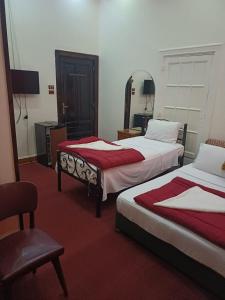 Voodi või voodid majutusasutuse Meramees Hotel toas