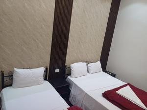 Voodi või voodid majutusasutuse Meramees Hotel toas