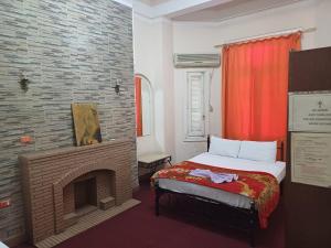 Voodi või voodid majutusasutuse Meramees Hotel toas