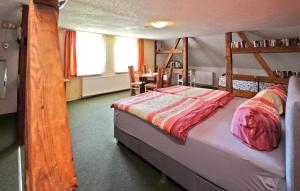 a bedroom with two bunk beds and a table at 1 Bedroom Stunning Apartment In Meiersberg in Meiersberg