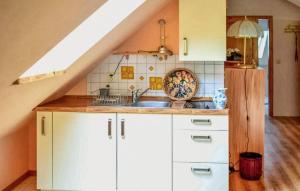 a kitchen with white cabinets and a sink at Gorgeous Apartment In Schwarzenhof With Wifi in Schwarzenhof