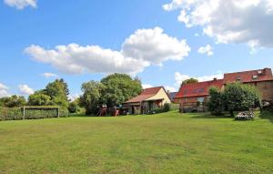 a large yard with two houses and a house at Amazing Home In Thomsdorf With Wifi in Thomsdorf