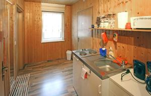 A kitchen or kitchenette at Nice Apartment In Rheinsberg Ot Kleinzer With Wifi