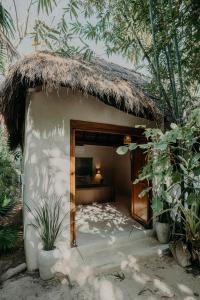a small hut with a bed in it at Sacred Hideaways in Tulum