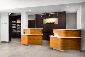 a store with two wooden counters in a room at Courtyard by Marriott Concord in Concord