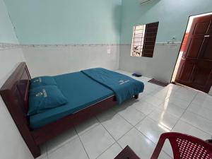 En eller flere senger på et rom på Nhà nghỉ Minh Tú
