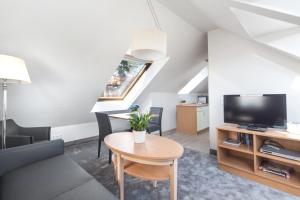 TV a/nebo společenská místnost v ubytování Apartmenthaus Seehof