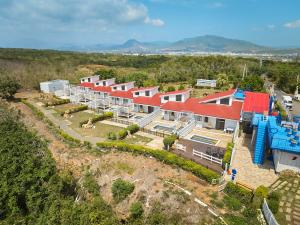 an aerial view of a house with a water park at Cliff Villa in Hengchun