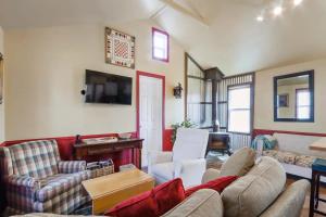 a living room with a couch and chairs and a tv at New charming Lakeview Haven 2BR Cozy Como Cottage with Lake Views in Lake Geneva