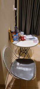 a table and a chair with a table and a table and a table at REDHOME DORM in Ho Chi Minh City