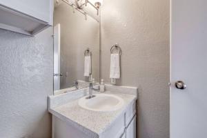 a bathroom with a sink and a mirror at Cozy 2BD Apt Austin Texas in Austin