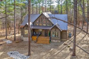 a cabin in the middle of the woods at Pine Creek Lodge in Broken Bow