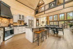 a large kitchen with a large island in a barn at Pine Creek Lodge in Broken Bow
