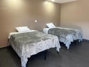 Katil atau katil-katil dalam bilik di Pomona Inn