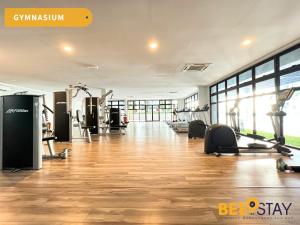 a gym with treadmills and exercise equipment in a building at Admiral Residence Melaka City Centre Family Suite 5 minutes to Jonker Street in Melaka