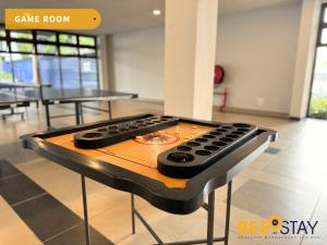 a remote control sitting on a table in a room at Admiral Residence Melaka City Centre Family Suite 5 minutes to Jonker Street in Melaka