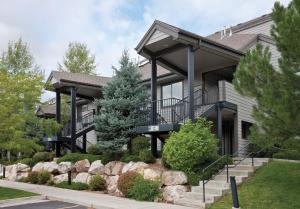 a large house with a porch and landscaping at WorldMark Wolf Creek in Eden
