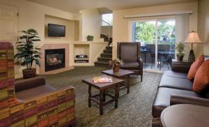 a living room with a couch and a fireplace at WorldMark Wolf Creek in Eden