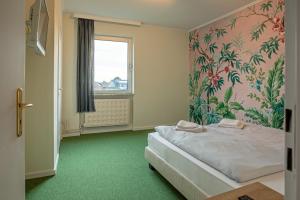 Postel nebo postele na pokoji v ubytování WannerHus Hotel