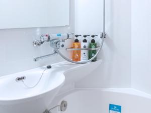 a bathroom with a sink and a mirror at APA Hotel AkihabaraSuehirocho Ekimae -Electric Town- in Tokyo