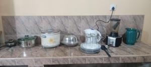 a counter top with various appliances on it at Cliff Heaven Bungalow in Bandarawela