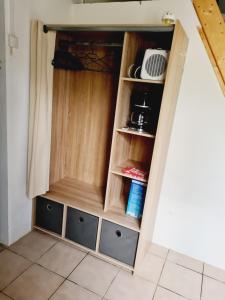 a cupboard with drawers in a room at Maison calme proche étang in La Coquille