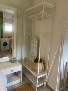 a room with a white closet with a shelf at SnD Rentals- Studios in Kozani