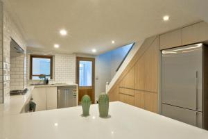 a kitchen with a white counter top in a room at Good for Family 3 Bedroom House Darlinghurst with 2 E-Bikes Included in Sydney