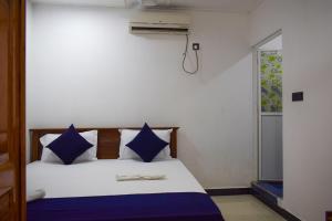 Postel nebo postele na pokoji v ubytování ROLEX GUEST HOUSE + 8 fotografií