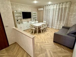 a living room with a table and a couch at Columbia House in Palmi