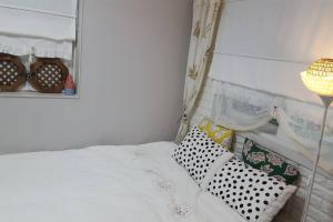Postel nebo postele na pokoji v ubytování Sodamhang in Damyang