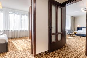 Postel nebo postele na pokoji v ubytování Žilvinas Hotel
