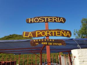 a sign for a la porttera restaurant at Hostería La Porteña - La Serranita in La Bolsa